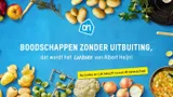 Groente en fruit met het Albert Heijn logo en de tekst: Boodschappen zonder uitbuiting, dat wordt het lekkere van Alber Heijn! Na Jumbo en Lidl belooft nu ook AH beterschap!