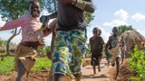 Children play near their homes at the Bidi Bidi refugee settlement in Uganda