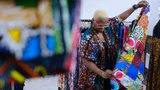 Yetunde Akande looks at a fabric