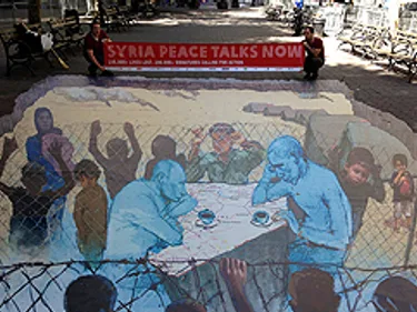 Streetart van mensen aan een tafel