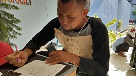 Foto van Anjas die een formulier invult.