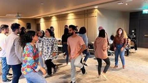 A group of people dancing.