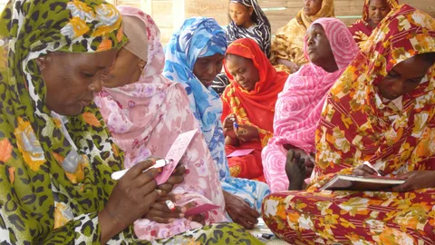 Photograph of a group of women participating in a development association