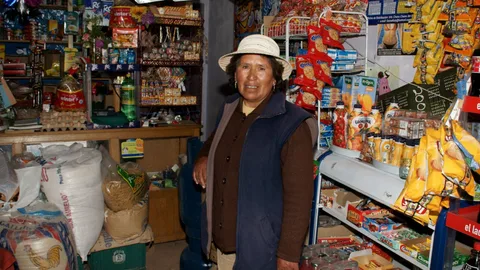 Photograph of a woman standing in a shop
