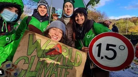 Young people with protest signs.