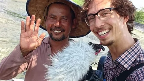 Foto van Guido Castagna en een boer.