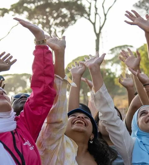 Women looking up and waving.