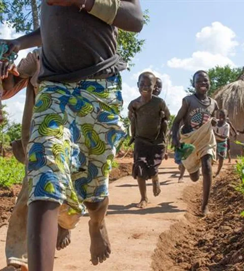 Children play near their homes at the Bidi Bidi refugee settlement in Uganda