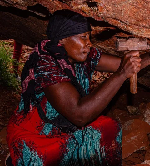 Photograph of a woman in a mine