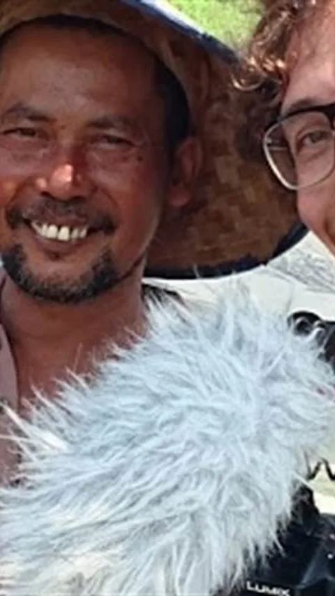 Foto van Guido Castagna en een boer.